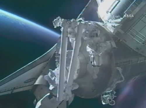 Shuttle Crew Hits Mission Midpoint with Robot Arm Test
